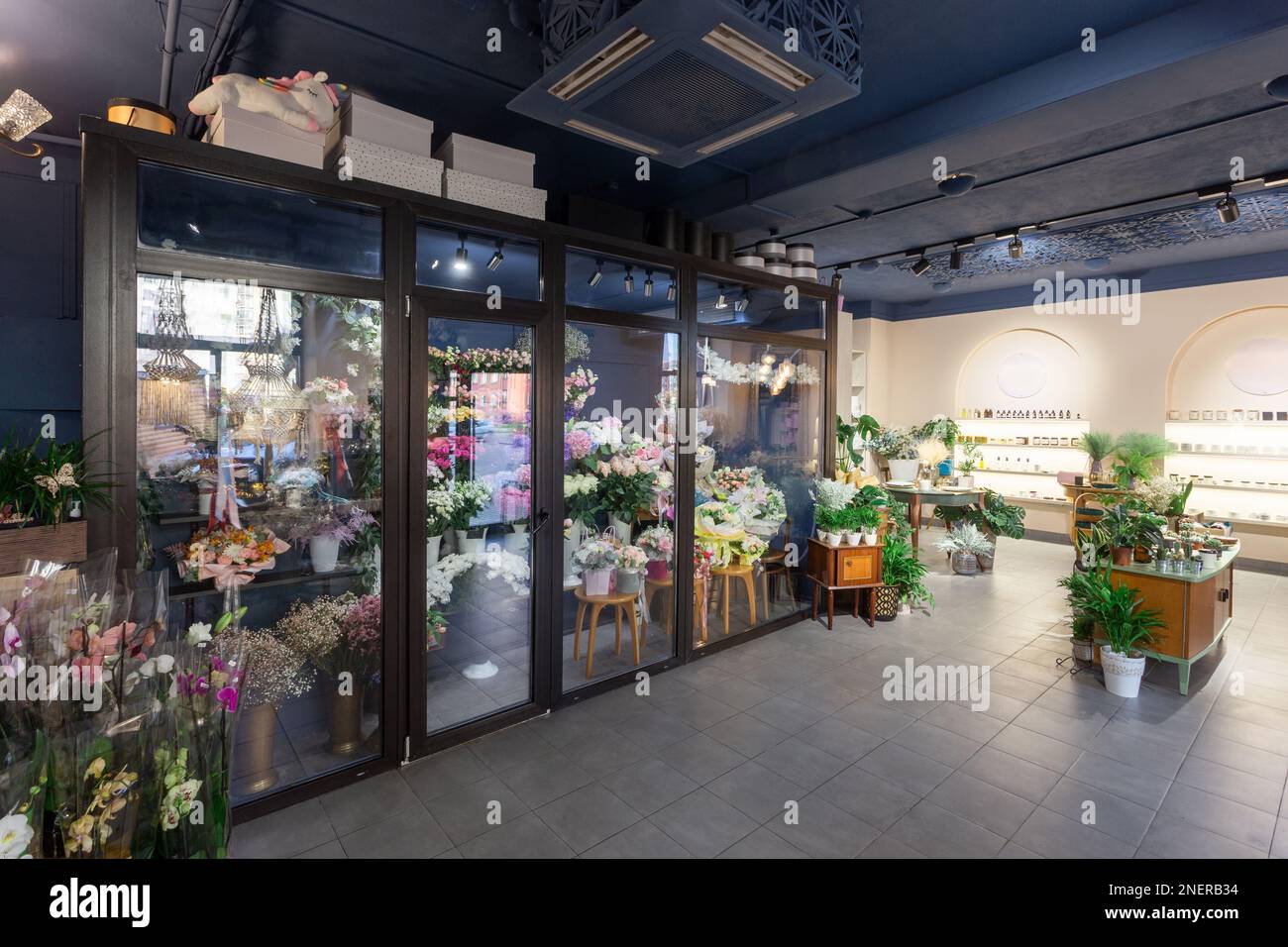 Flowers shop interior with cold storage for flowers demonstrating and