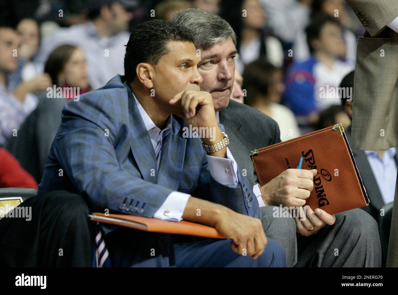 Minnesota Timberwolves assistant coaches Reggie Theus, left, and Bill