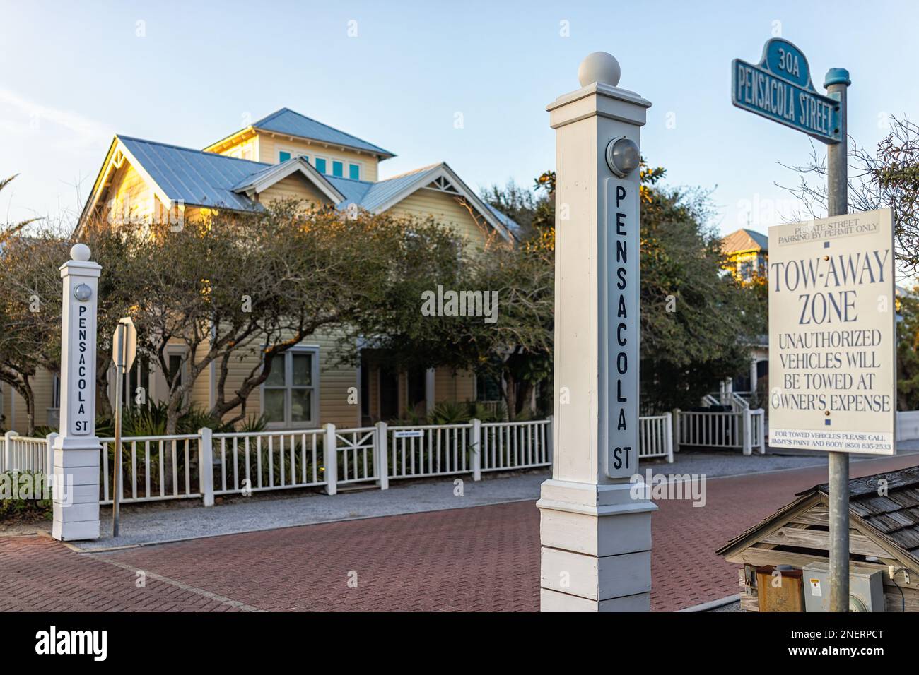 Seaside, USA - January 14, 2021: Modern buildings in new urbanism architecture by beach at Seaside, Florida in winter sunset with parking sign and Pen Stock Photo