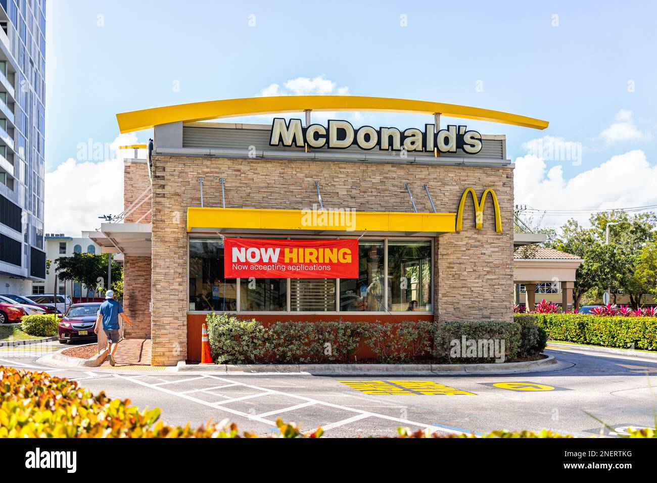 Sunny Isles Beach, USA - February 12, 2022: McDonald's fast food quick service restaurant cafe in Miami, Florida with banner sign for work job vacancy Stock Photo