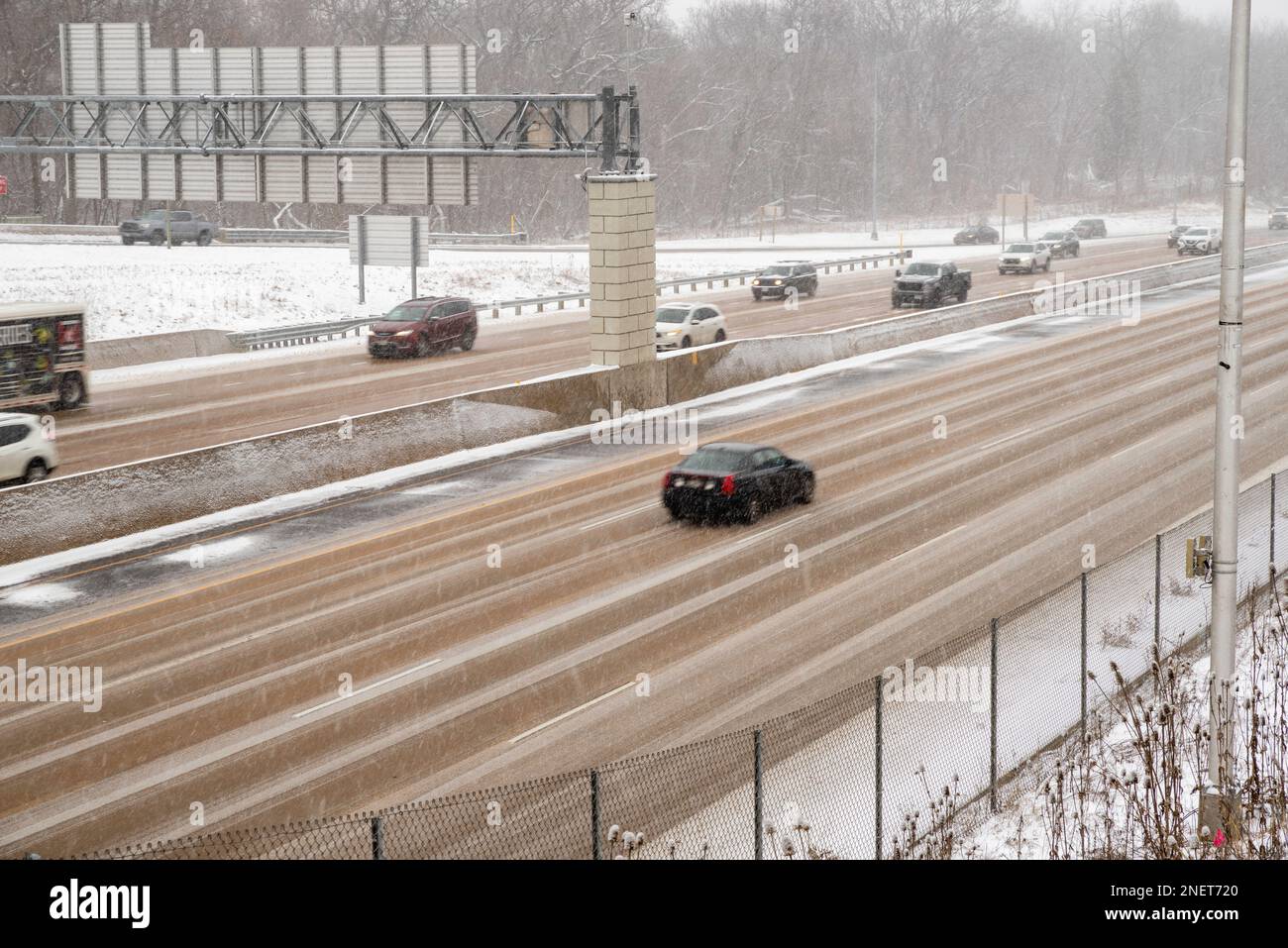 Photograph of highway traffic taken during a winter snow storm. Madison