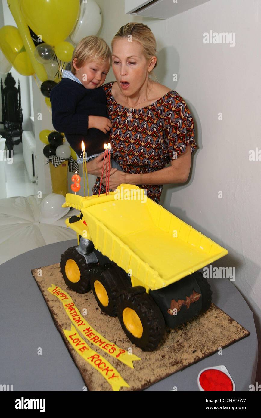 Kelly Rutherford and son Hermes attend a Rocky the Robot Truck themed ...