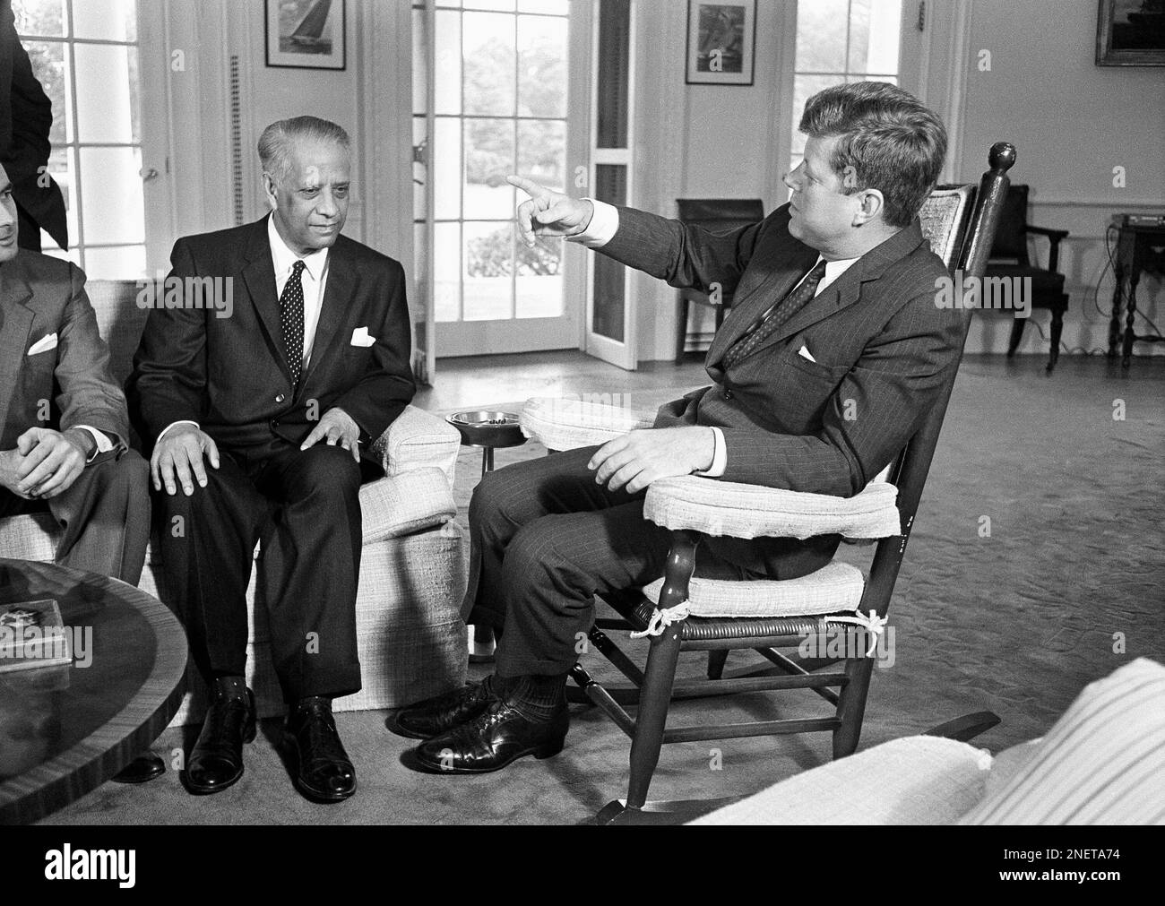 President John Kennedy makes a point from his well-known rocking chair ...