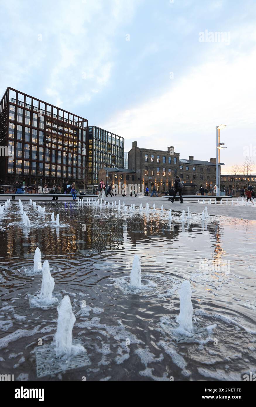 View across fountains in Granary Square, in late afternoon winter