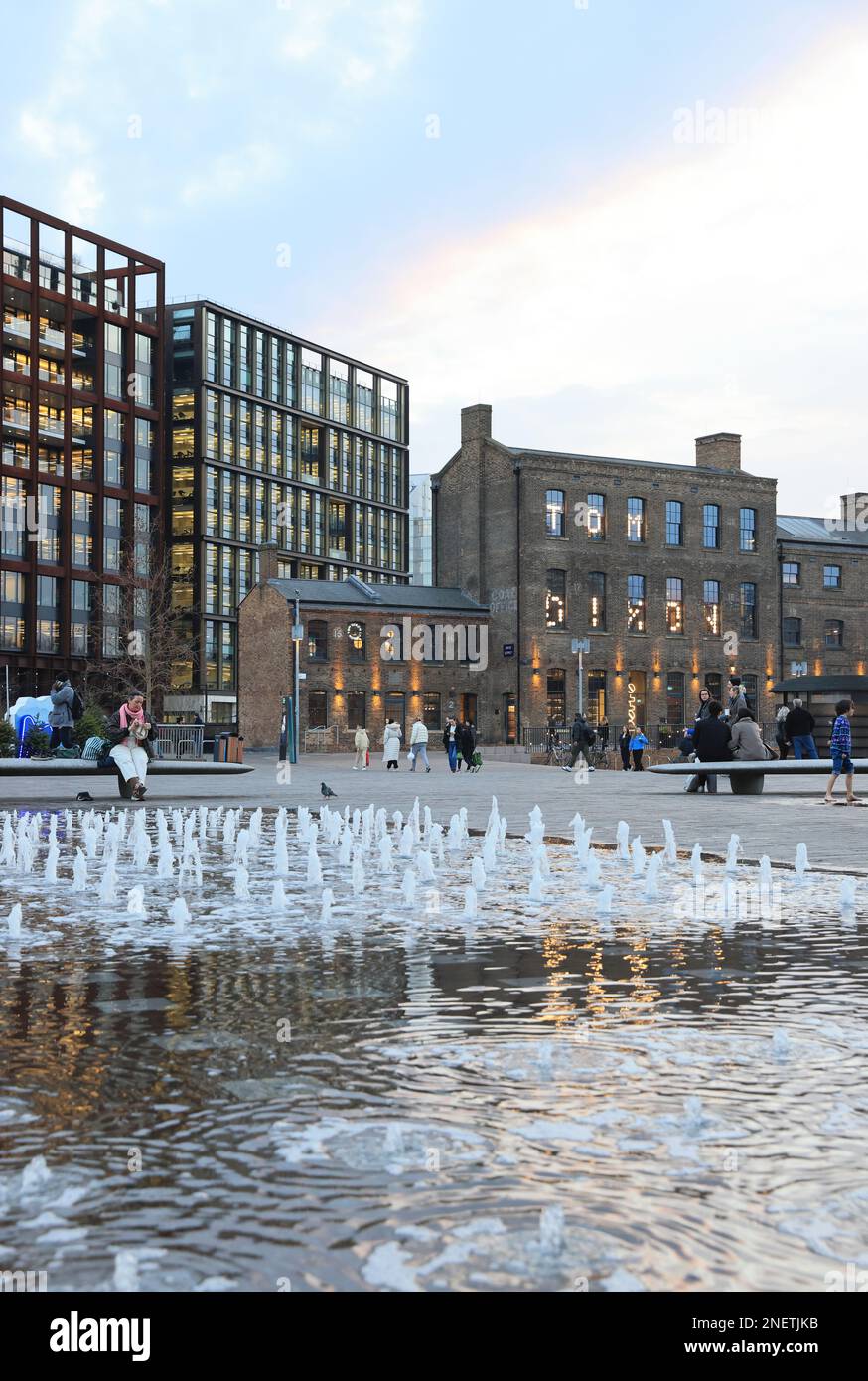 View across fountains in Granary Square, in late afternoon winter