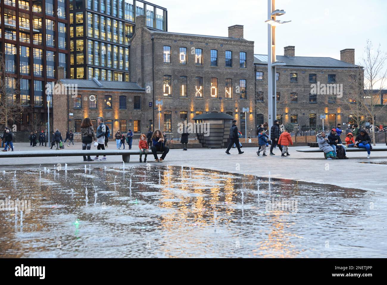 View across fountains in Granary Square, in late afternoon winter