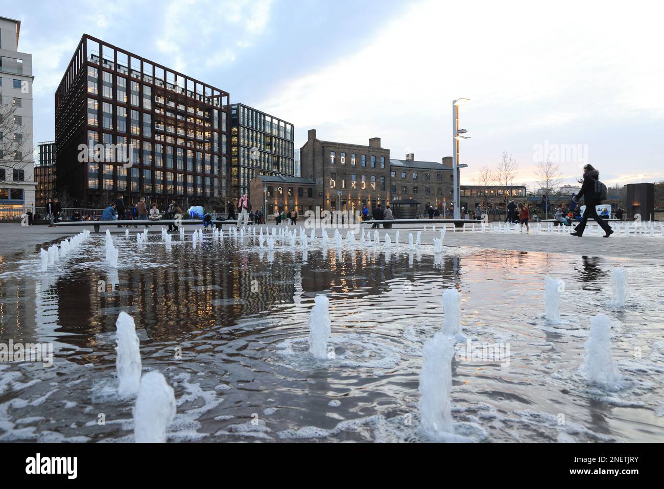 View across fountains in Granary Square, in late afternoon winter