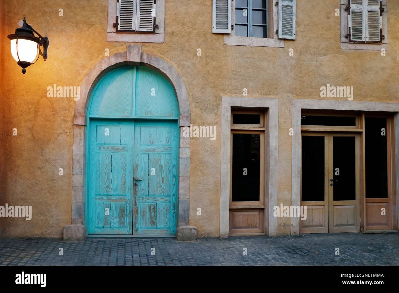 front view of and Authentic old house with wooden door and glass window ...
