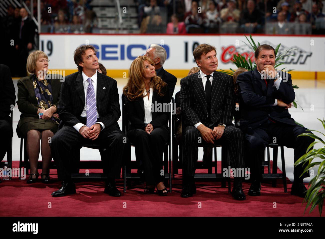 Joe Sakic, right, looks on during a ceremony to mark his
