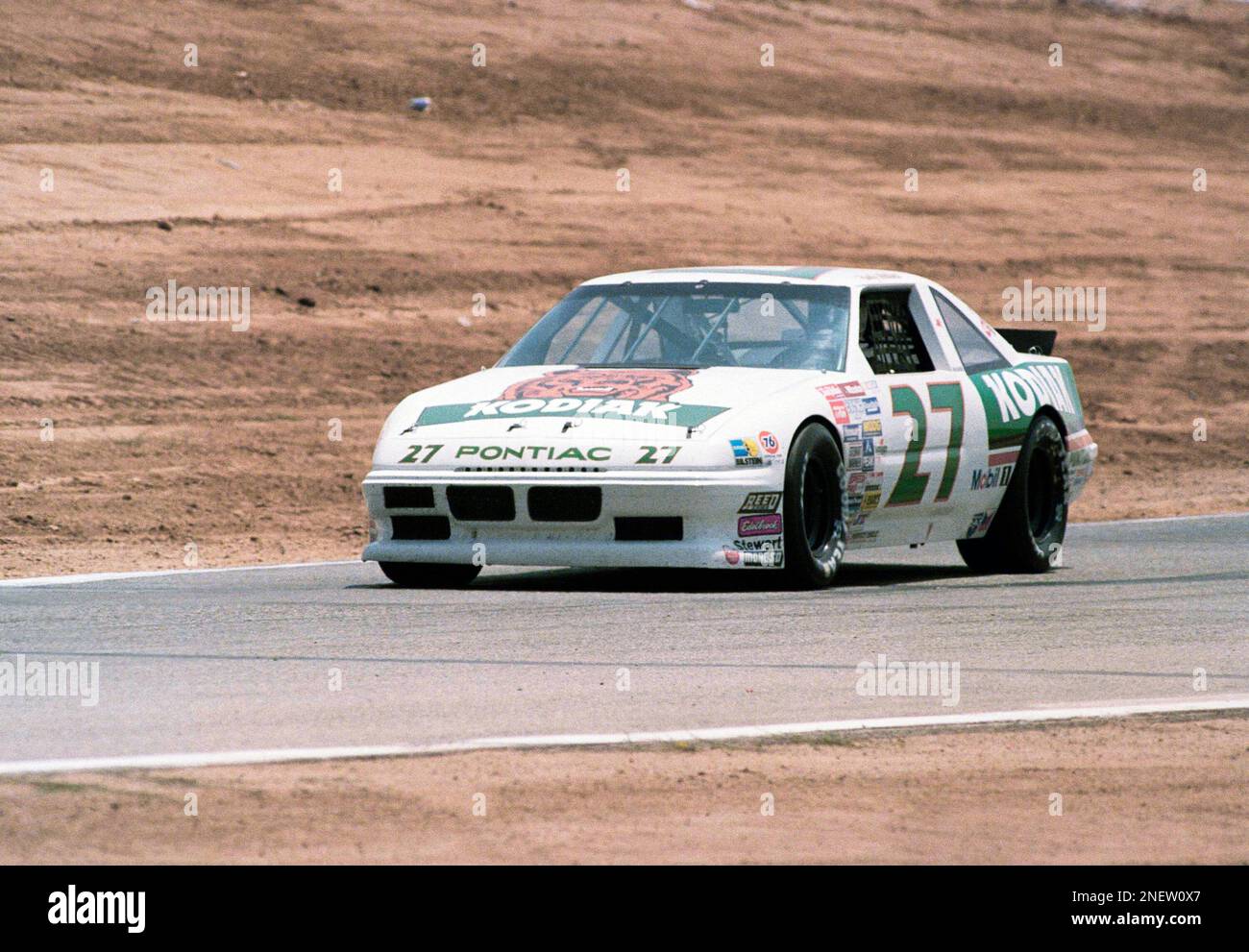 rusty-wallace-of-charlotte-nc-drives-his-pontiac-grand-prix-to-victory-in-the-budweiser-400-stock-car-race-at-riverside-international-raceway-riverside-calif-june-13-1988-the-bud-400-is-the-last-stock-car-race-scheduled-at-the-track-which-is-set-for-demolition-later-this-summer-ap-photomark-terrill-2NEW0X7.jpg
