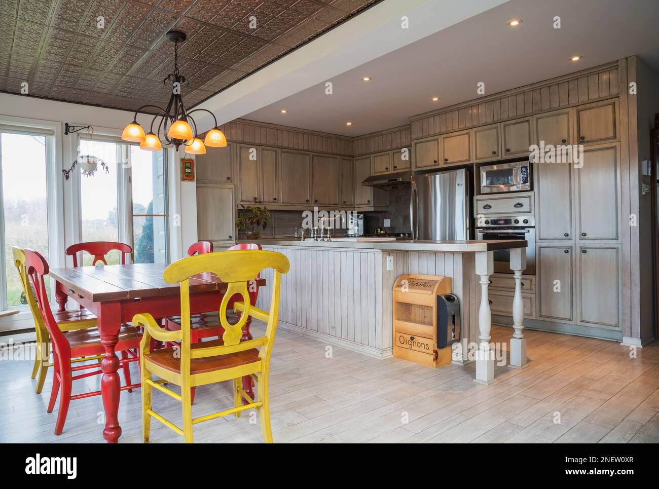 Red pinewood dining table and cherrywood high back chairs in country