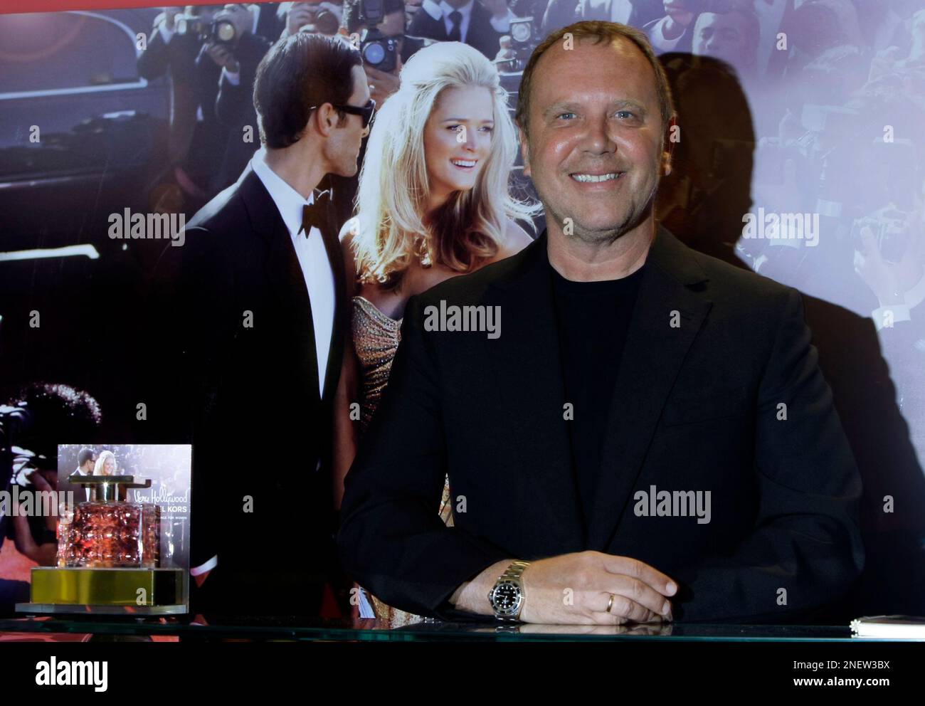 US fashion designer Michael Kors at Harrods department store as he poses  for the cameras at the launch of the Very Hollywood Michael Kors  fragrance.in London, Thursday, Oct. 1, 2009 . (AP