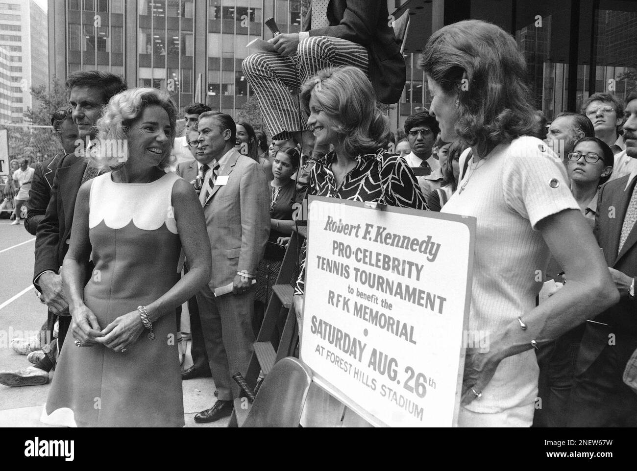 Members of the Kennedy family chat in front of the Seagram Building on