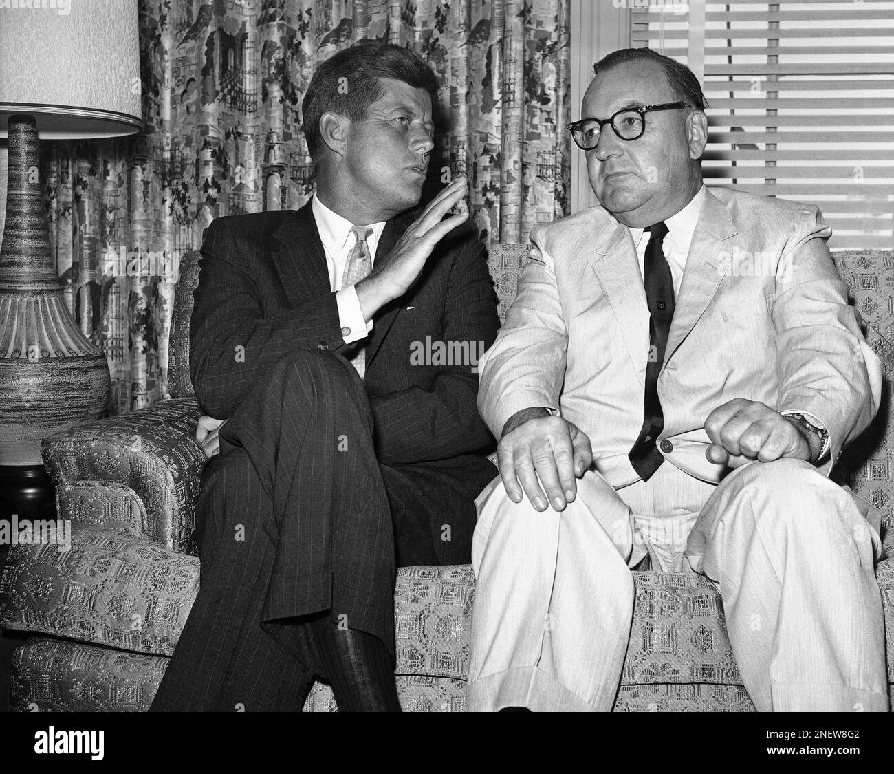 Sen. John F. Kennedy of Massachusetts gestures during his meeting with Gov.  Edmund G. (Pat) Brown of California in Los Angeles on July 10, 1960. Brown,  whose favorite son votes Kennedy has