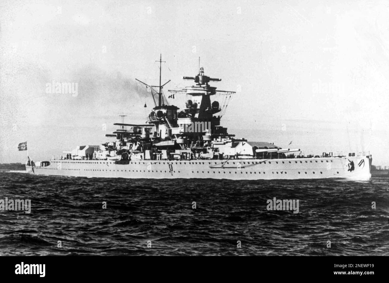 The German pocket battleship Admiral Scheer leaves a harbour, somewhere