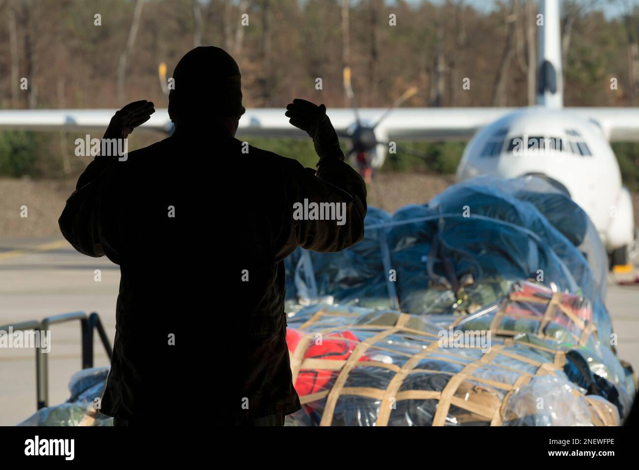 February 8, 2023 - Ramstein Air Base, Rheinland-Pfalz, Germany - A loadmaster from the 37th Airlift Squadron guides palettes of luggage onto a C-130J Super Hercules aircraft at Ramstein Air Base, Germany, February. 8, 2023. Airmen and supplies from Team Ramstein load onto the C-130J to deliver disaster relief and assistance to Incirlik AB, Turkey, after a 7.8-magnitude earthquake occurred in the border region on February. 5, 2023. Credit: U.S. Air Force/ZUMA Press Wire Service/ZUMAPRESS.com/Alamy Live News Stock Photo