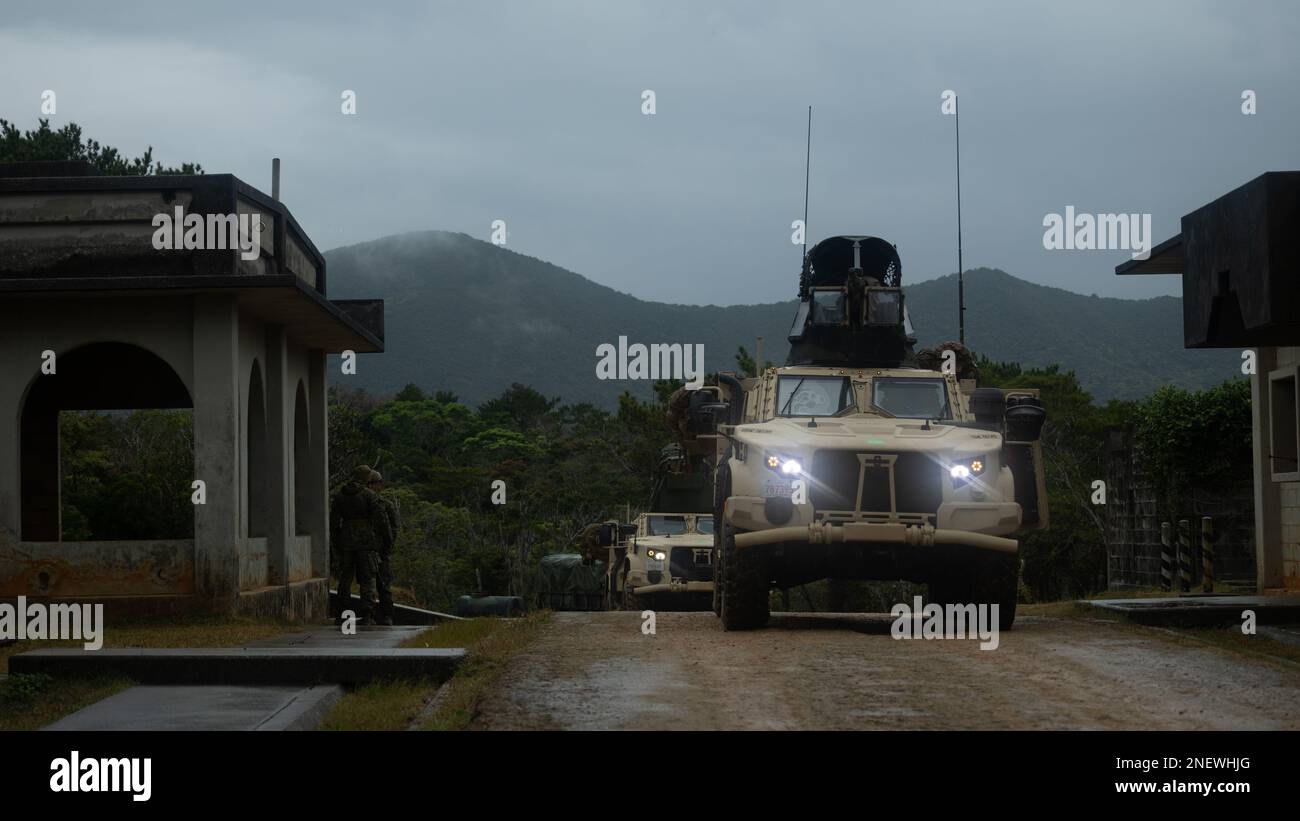 U.S. Marines with 1st Battalion, 7th Marines conduct a convoy using Joint Light Tactical Vehicles to reach an objective during Jungle Warfare Exercise 23 in the Northern Training Area on Okinawa, Japan, Feb. 14, 2023.23In the Northern Training Area on JWX 23 is a large-scale field training exercise focused on leveraging the integrated capabilities of joint and allied partners to strengthen all-domain awareness, maneuver, and fires across a distributed maritime environment. (U.S. Marine Corps photo by Lance Cpl. Noah Masog) Stock Photo