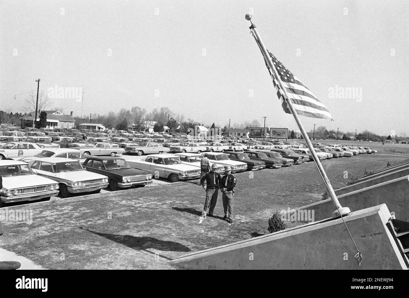 Alabama state patrol cars fill a parking lot of the National Guard
