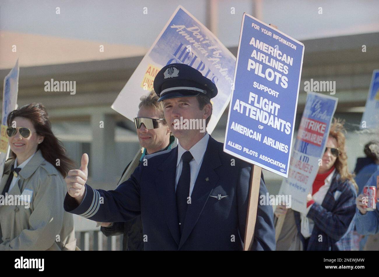 American Airlines pilot Darrell Morgan gives the thumbs-up sign showing ...