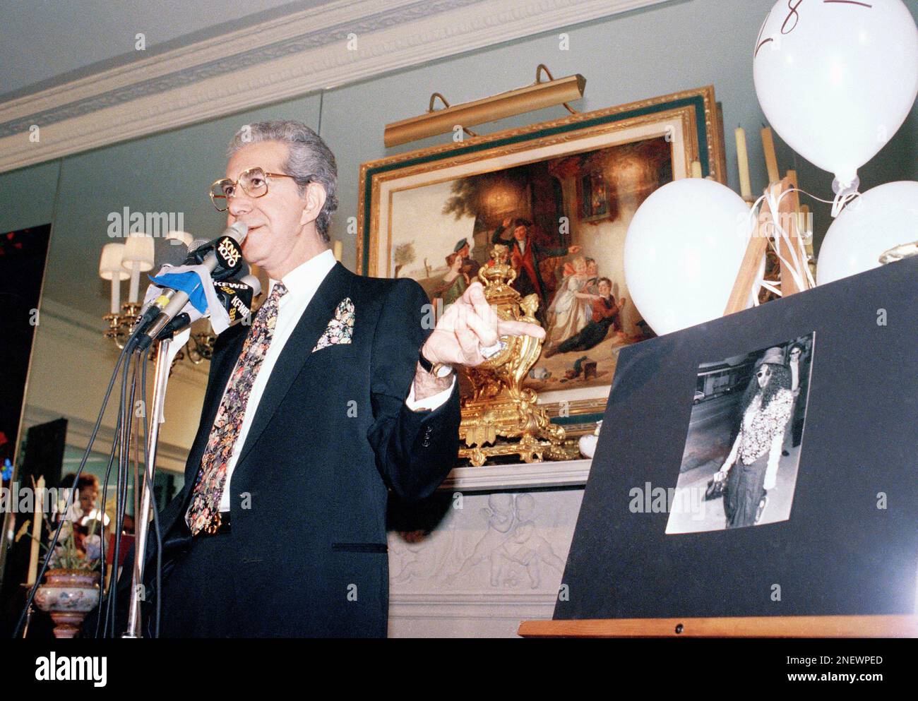Fashion designer Mr. Blackwell gestures as he tells reporters that