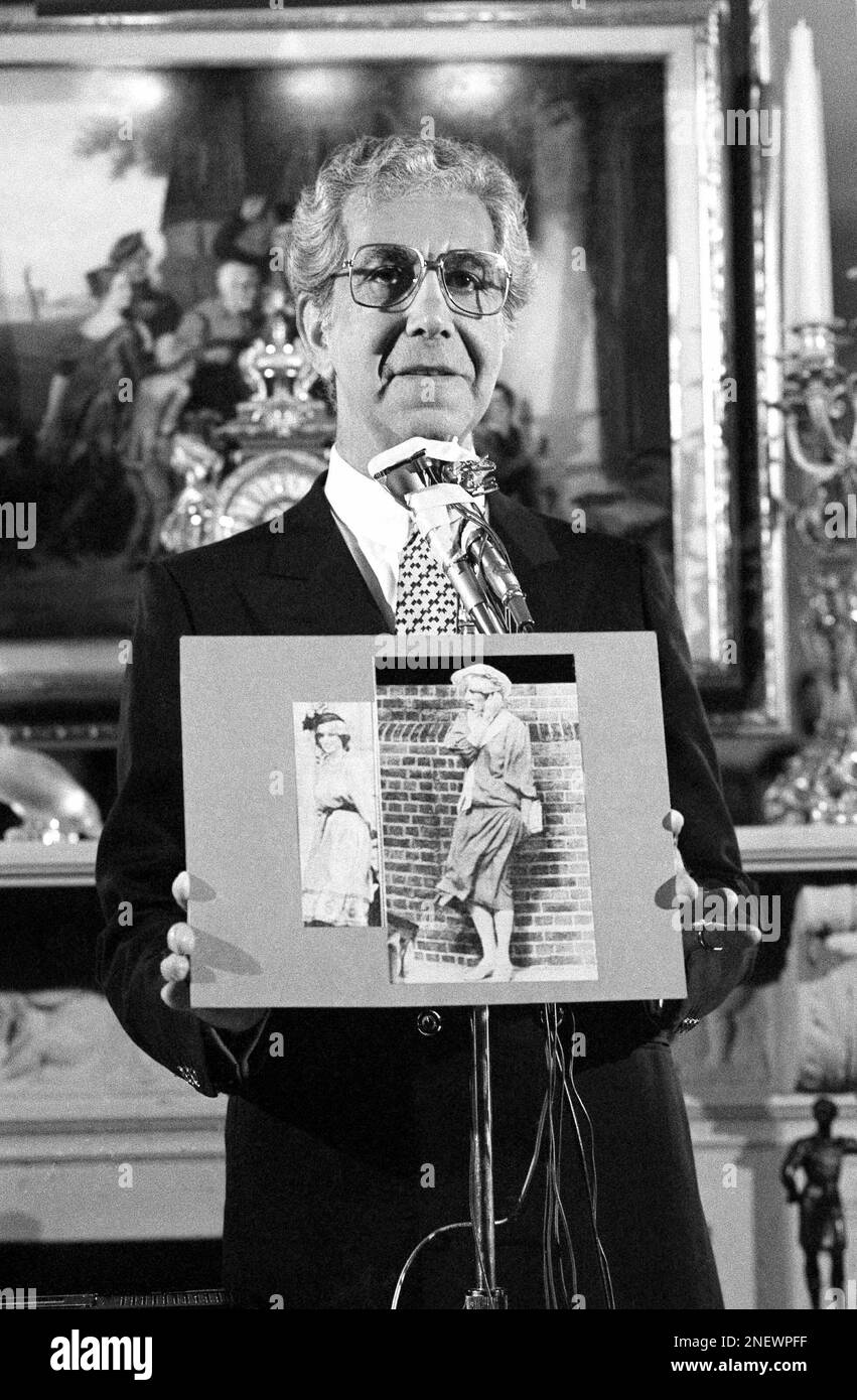Fashion designer Mr. Blackwell holds photos of those included on his