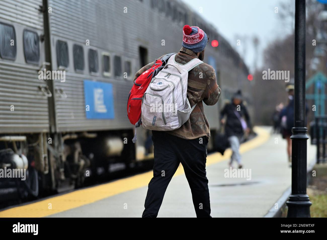 Winfield, Illinois, USA. Passengers disembarking a Metra commuter train in the western suburbs of Chicago. Stock Photo