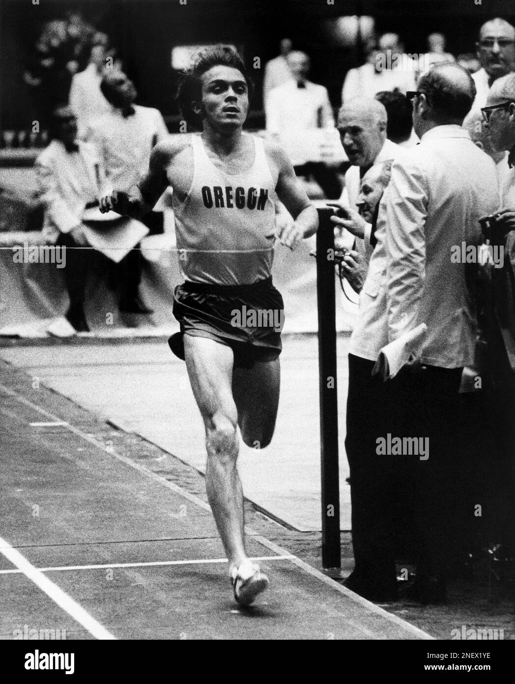 Steve Prefontaine of the University of Oregon, crosses the finish line to  win the two-mile run in the Times Indoor Games in Los Angeles on Friday,  Feb. 12, 1972. Prefontaine cruised home