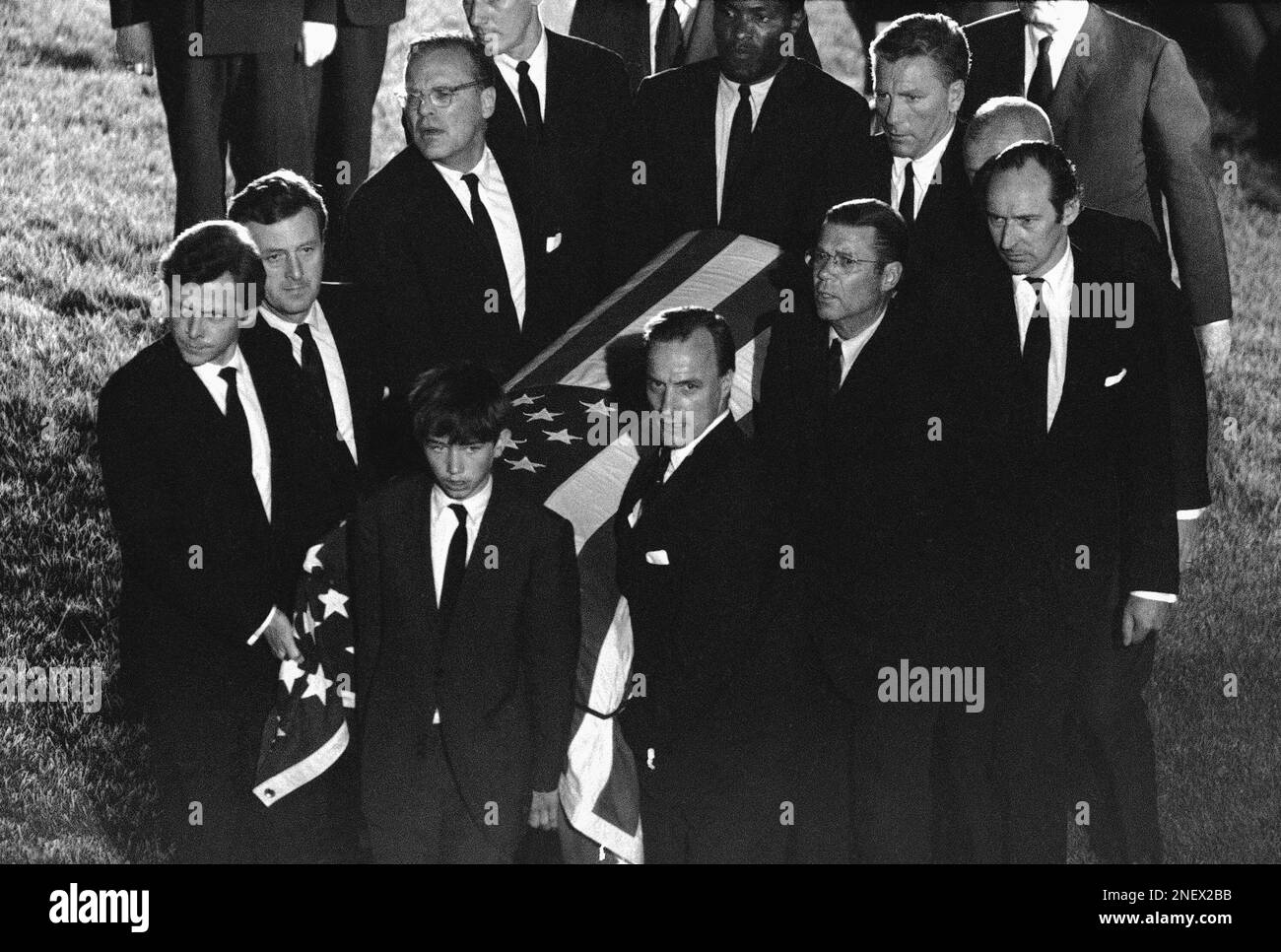 The casket of Robert F. Kennedy is carried to the grave site at ...