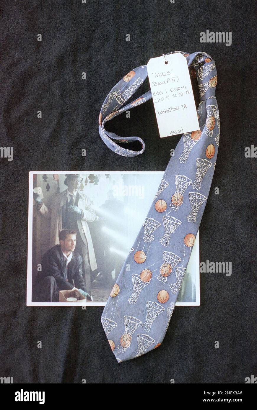 A tie worn by Brad Pitt in the film “Seven” is laid over a still photo