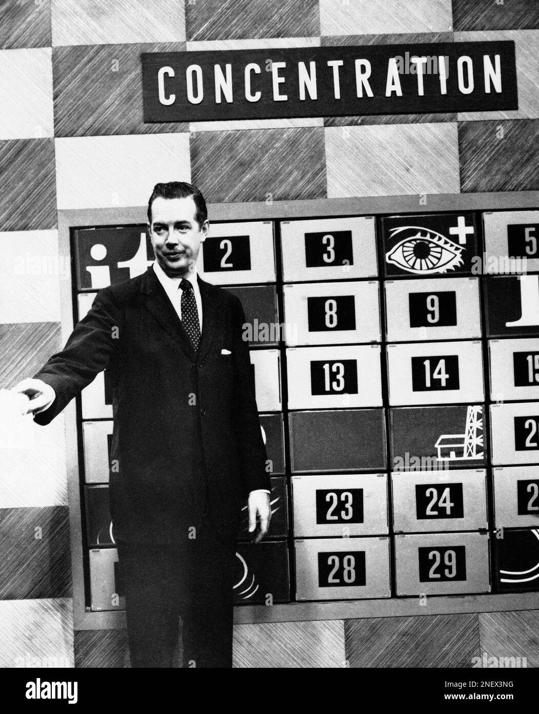 Hugh Downs, shown on the television set of his day-time game show, “Concentration,” (NBC) has taken over Arthur Godfrey’s title as the most visible man in the country, April 14, 1960. Downs spends 9 ½ hours a week in front of TV cameras, most of it as announcer and performer on the Jack Paar Show. (AP Photo) Stock Photo