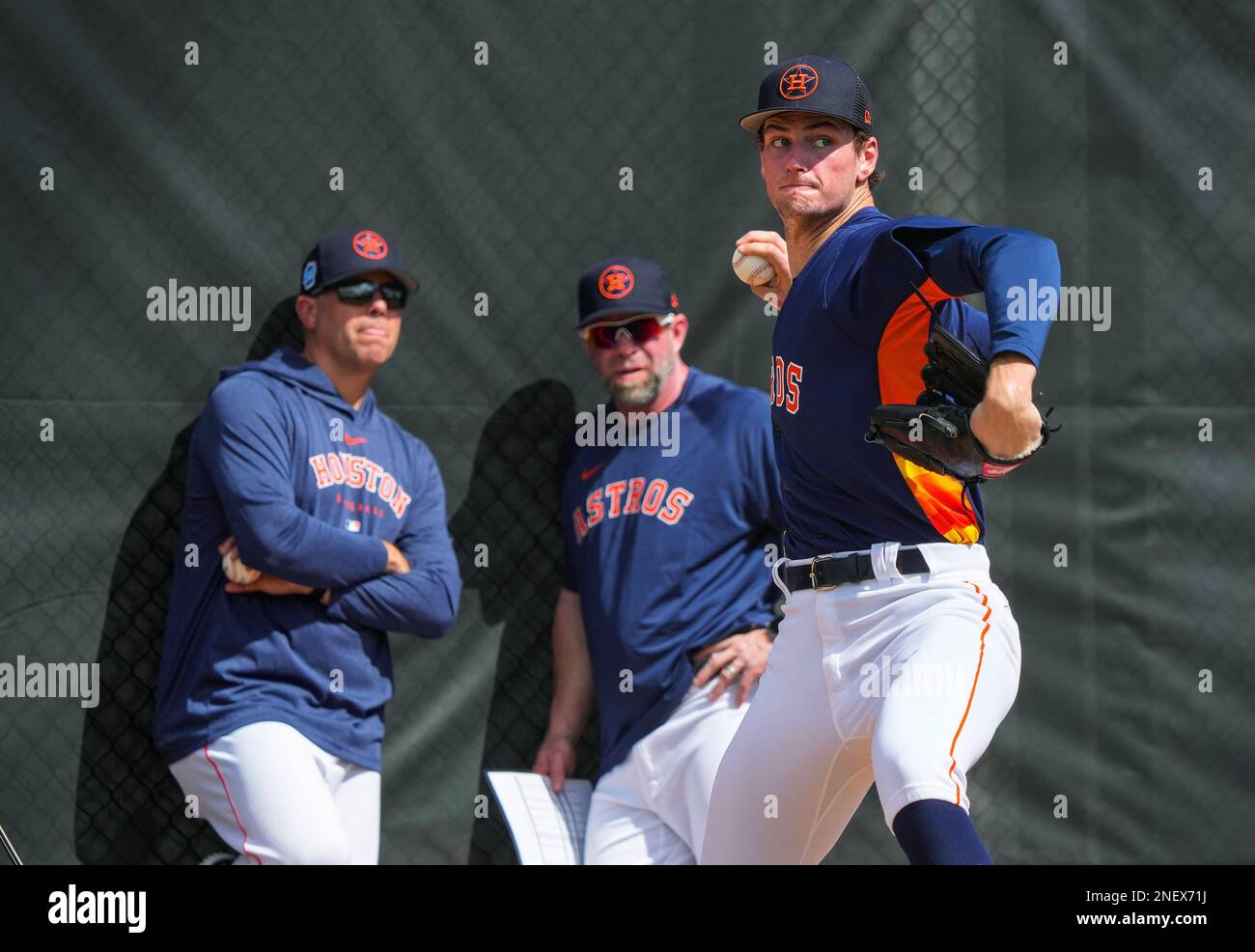 Houston Astros pitching coach Joshua Miller and Jeff Bagwell watch