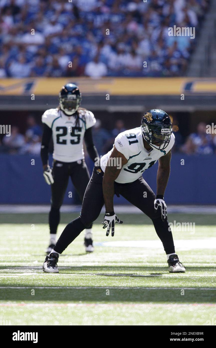 Jacksonville Jaguars defensive end Derrick Harvey, front, and safety Reggie  Nelson in the second half of the NFL football game, Sunday, Sept. 13, 2009  against the Indianapolis Colts in Indianapolis. The Colts