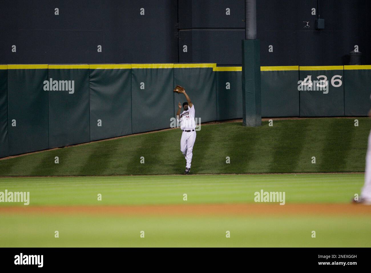 Houston Astros center fielder Michael Bourn catches a fly ball on Tal's Hill  at Minute Maid Park during the fourth inning of a baseball game against the  Atlanta Braves Tuesday, Sept. 8