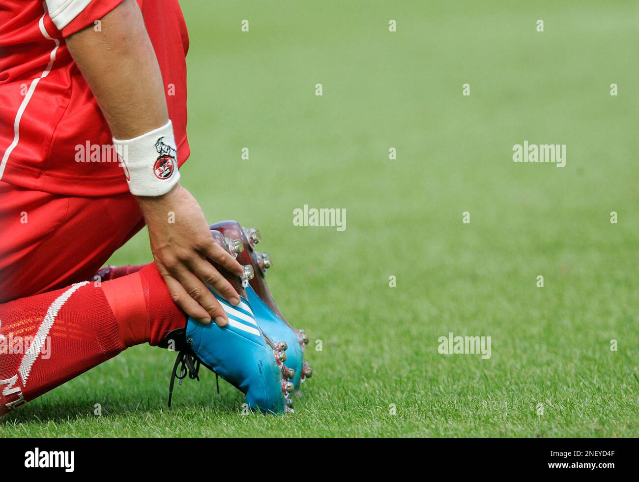 Cologne's Lukas Podolski's shoes with the name of his son Louis are seen  during the German first division Bundesliga soccer match between FC Cologne  and Eintracht Frankfurt in Cologne, Germany, Saturday, Aug.
