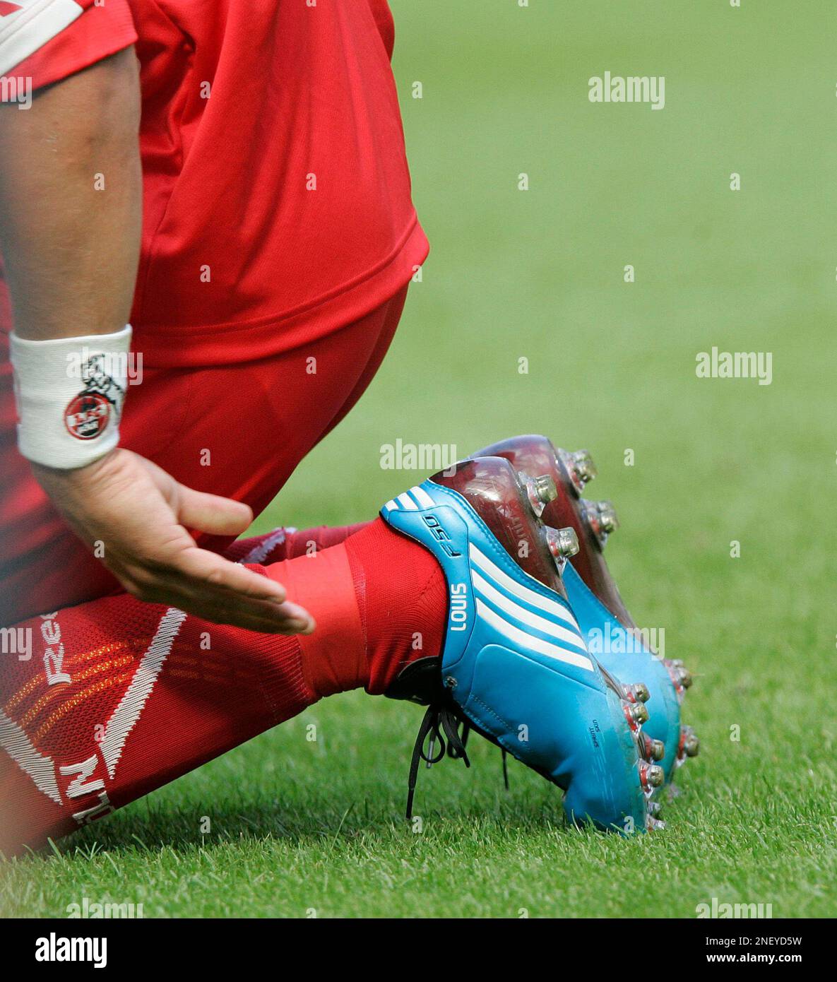 Cologne's Lukas Podolski's shoes with the name of his son Louis are seen  during the German first division Bundesliga soccer match between FC Cologne  and Eintracht Frankfurt in Cologne, Germany, Saturday, Aug.