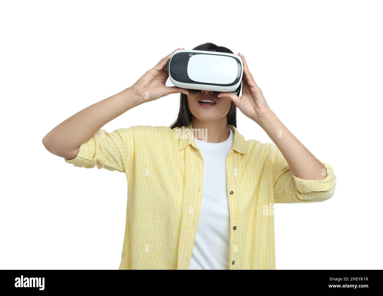 Woman using virtual reality headset on white background Stock Photo - Alamy