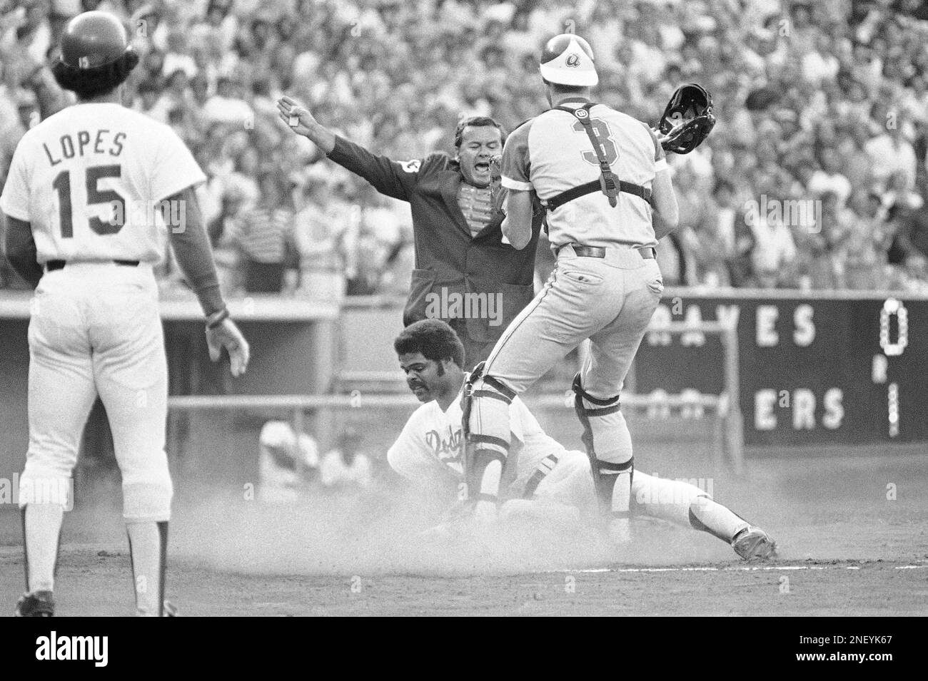 Home plate umpire Dutch Rennert calls Los Angeles Dodgers Reggie Smith safe  under Atlanta Braves catcher Dale Murphy (3) during the first inning in Los  Angeles on Wednesday, July 5, 1978. Smith