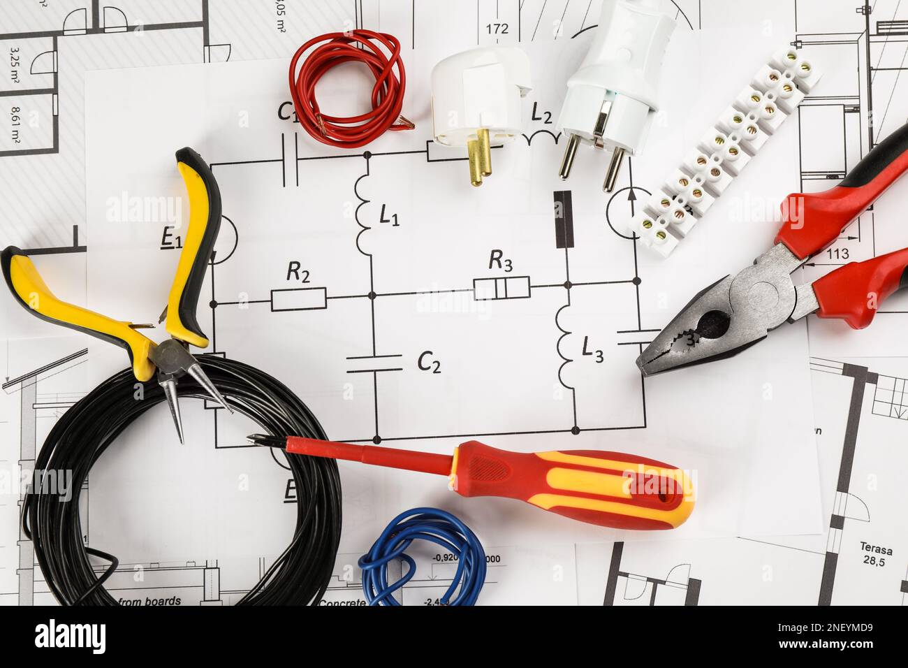 Flat lay composition with electrician's tools on house plan sheets