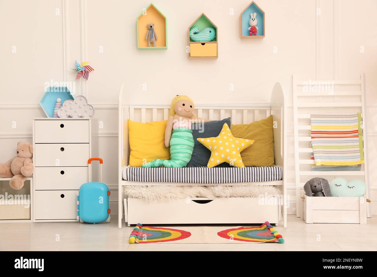 Cozy baby room interior with crib and toys Stock Photo Alamy
