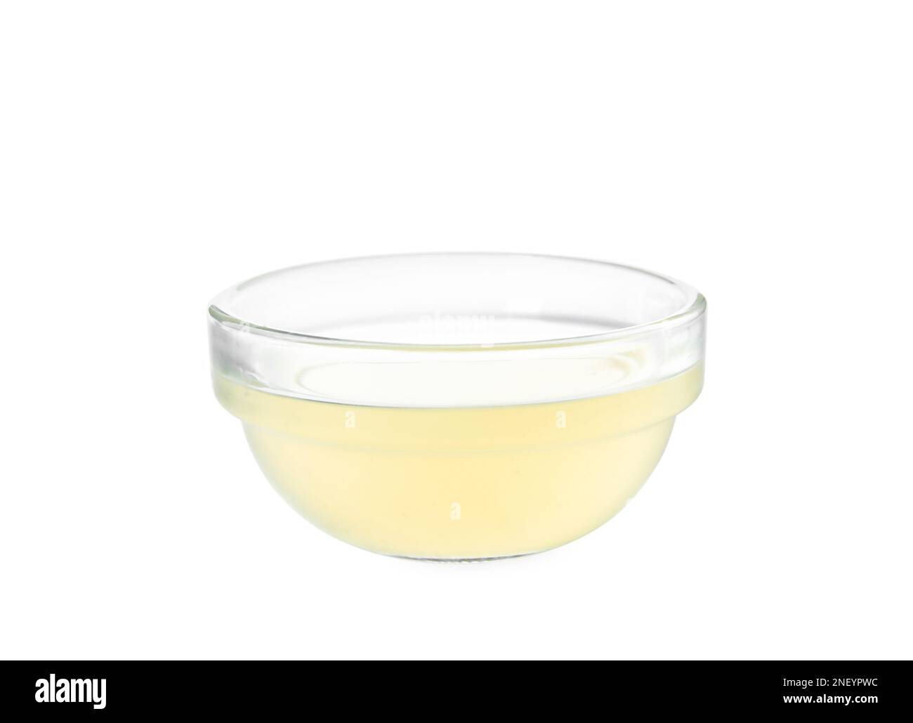 Freshly squeezed lemon juice in glass bowl isolated on white Stock Photo