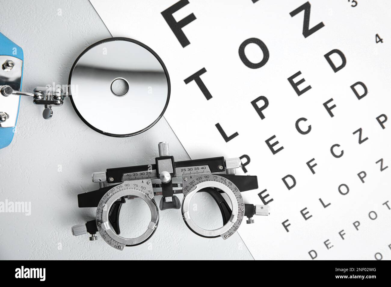 Different ophthalmologist tools on white table, flat lay Stock Photo ...