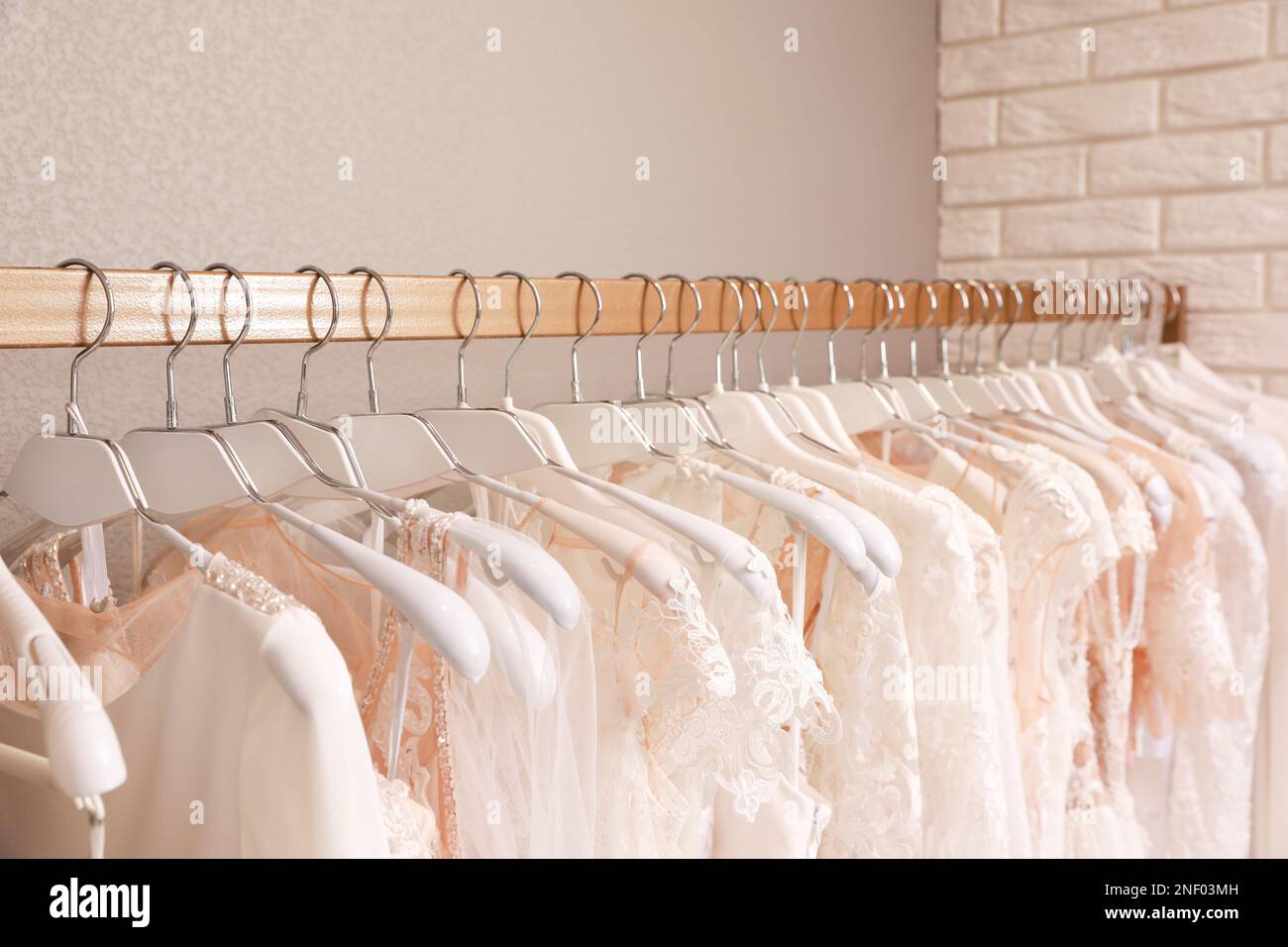 Dresses on hangers hi-res stock photography and images - Alamy