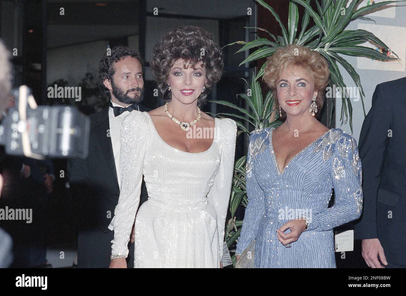 Actresses Joan Collins, left, and Elizabeth Taylor appear together