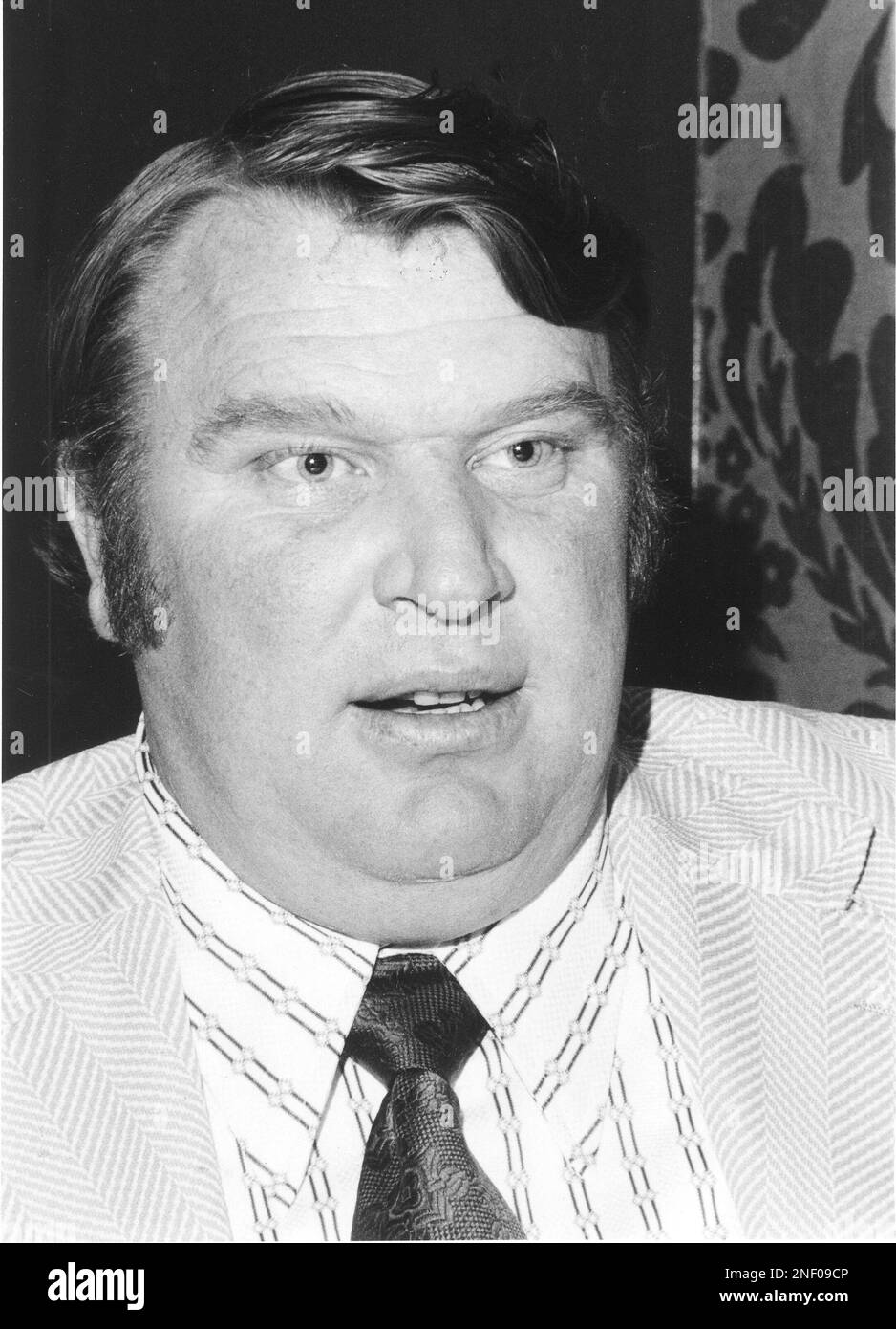 John Madden wipes away a tear at a news conference, Thursday, Jan. 4, 1979  in Oakland at which he announced he is retiring as coach of the Oakland  Raiders. “I'm never going