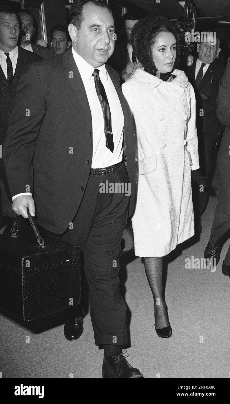 Actress Elizabeth Taylor, escorted by attorney Milton S. Rudin of Los ...