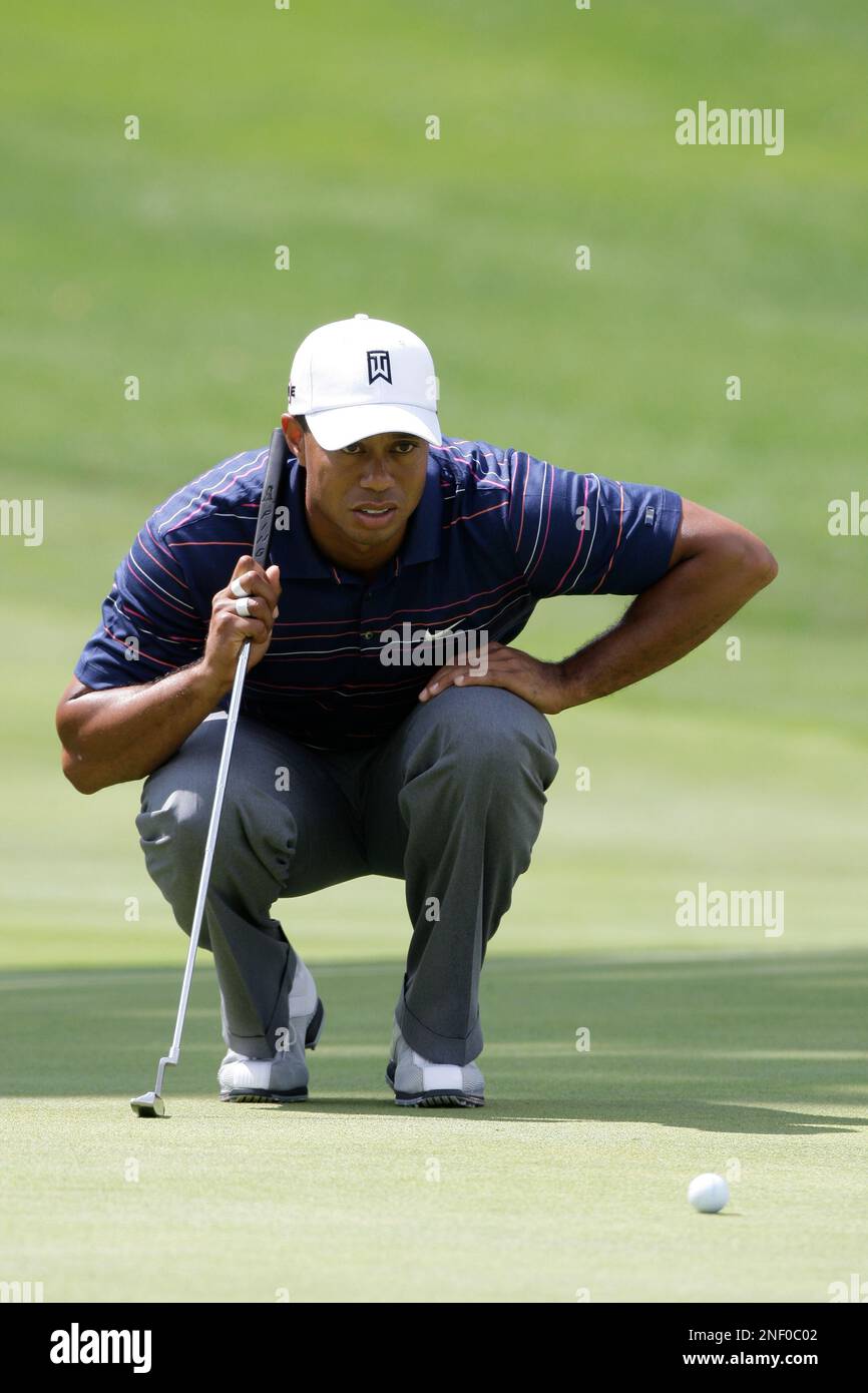 Tiger Woods lines up a putt during the second round of the Bridgestone  Invitational golf tournament Friday, Aug. 7, 2009, at Firestone Country  Club in Akron, Ohio. (AP Photo/Mark Duncan Stock Photo -