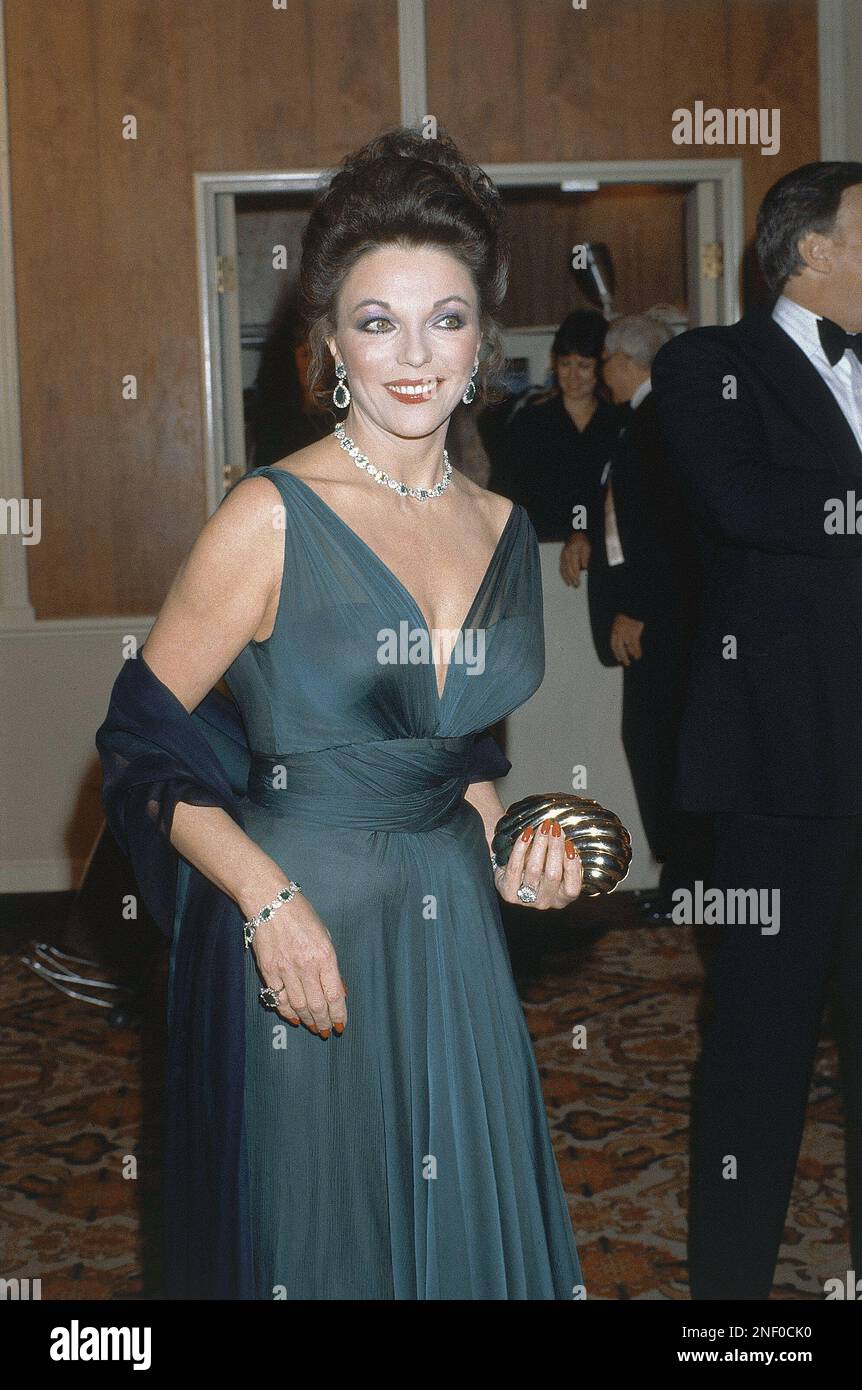 Actress Joan Collins poses at the Golden Globe Awards, Jan. 29, 1983