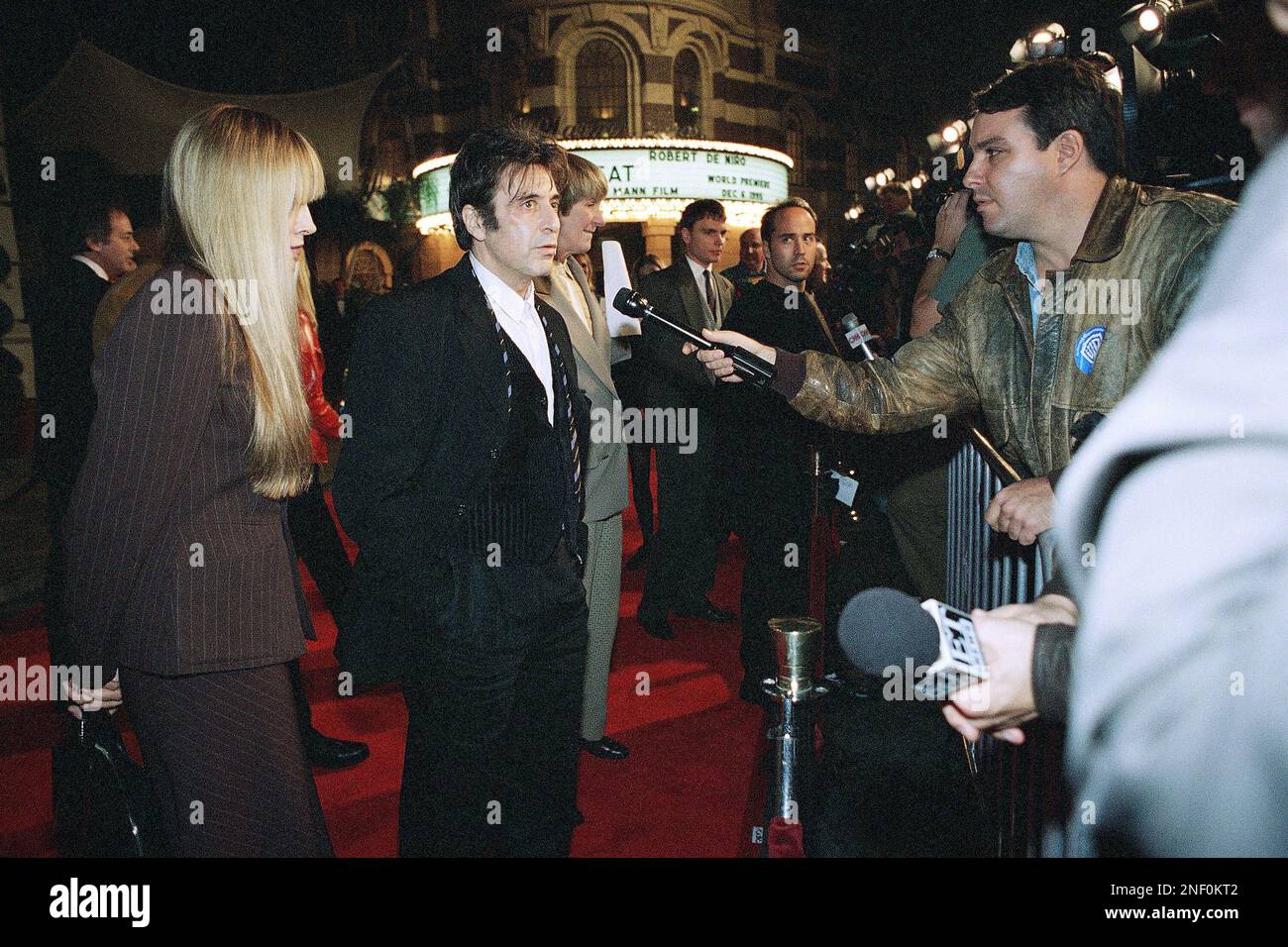 Actor Al Pacino talks with reporters as he arrives at the premiere of