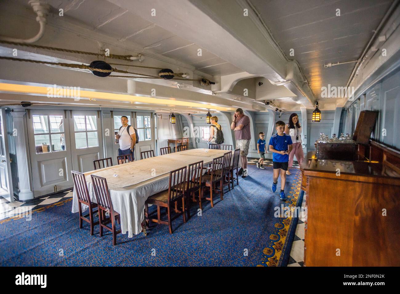 the Admiral's Dining Cabin at museum ship HMS Victory, Portsmouth Historic Dockyard, Hampshire, South East England Stock Photo