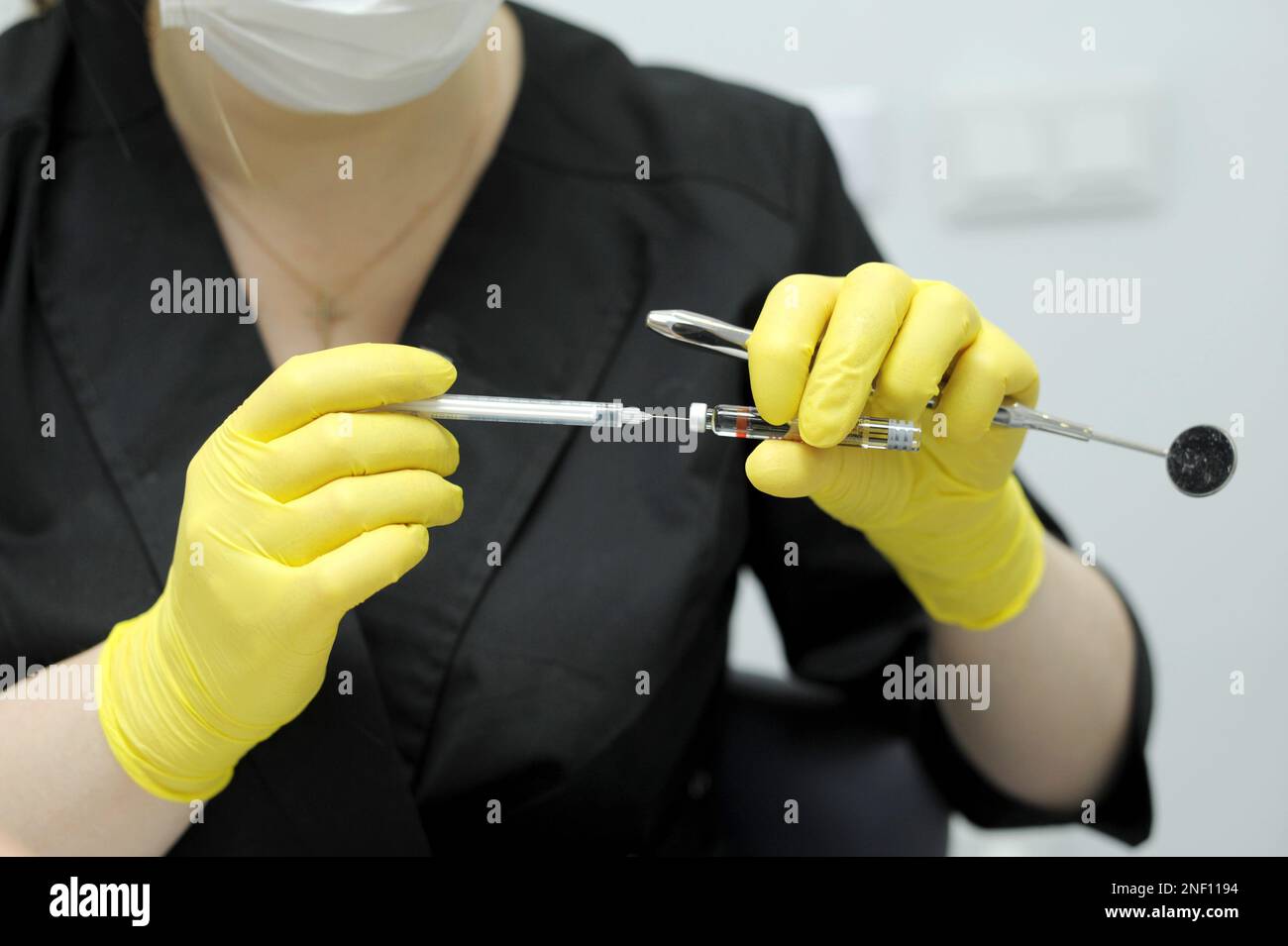 dental anesthesia in dentist's chair, needle of syringe, infiltration